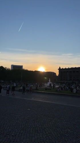 Berliners gather at Lustgarten park for sunset viewing