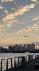 Aircraft descends for landing over London cityscape