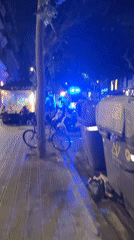 Ambulances respond to nighttime urban street incident