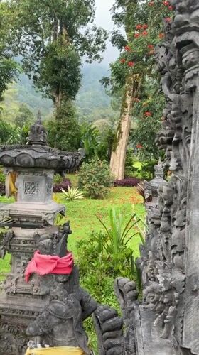 Temple visitors document Balinese architecture and animal interactions