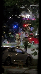 Quiet night on a Warsaw street, silver car parked nearby