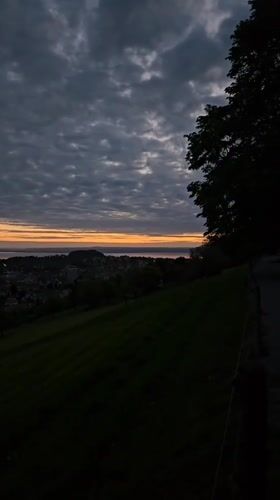Twilight scene captured over St. Gallen townscape and water