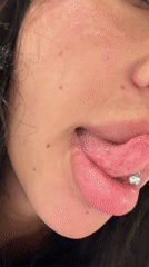Woman shows tongue piercing in videos with pet dog