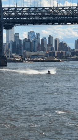 NYC skyline from the water, ferry and sailboat in frame