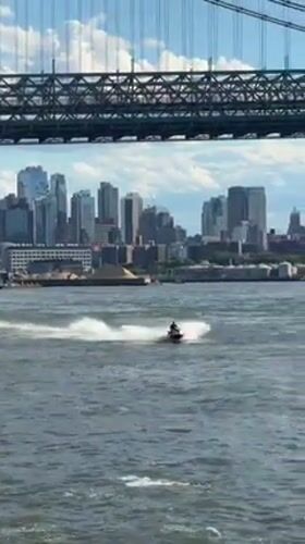 NYC skyline from the water, ferry and sailboat in frame