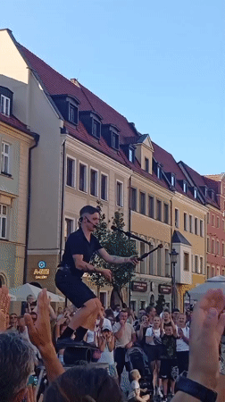 Fire juggling act on a Wrocław street platform