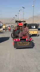 Street life in Quetta with traditional dress and custom vehicles