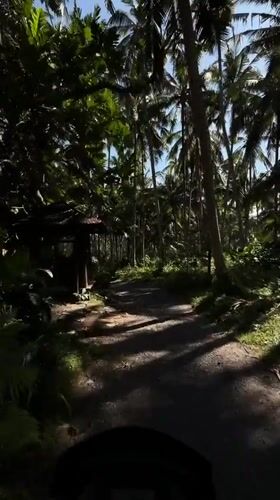 Scooter rider documents rural Karangasem countryside journey