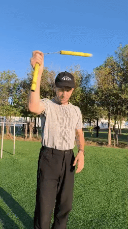 Solo martial arts and prop skill practice on a Karaganda field