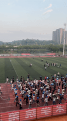 Students gather at athletic stadium in Jiangjin, China