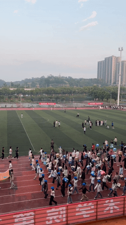 Students gather at athletic stadium in Jiangjin, China
