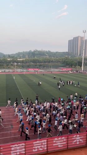 Students gather at athletic stadium in Jiangjin, China