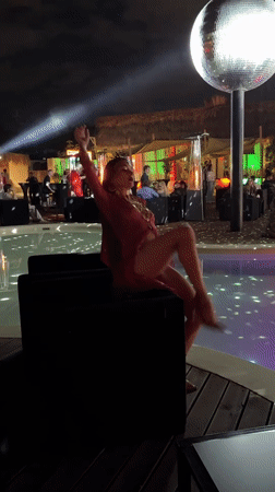 Traditional dancing performances captured at poolside venue in Armenia