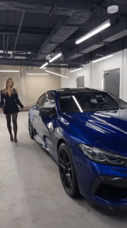 Professional car shoot featuring woman and BMW at Warsaw facility