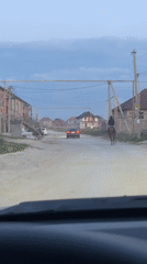 Vehicle spotted on dusty rural road in Kaspiysk