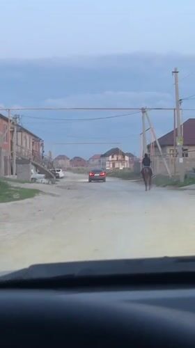 Vehicle spotted on dusty rural road in Kaspiysk