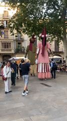 Traditional Catalan giant figures parade through Barcelona streets