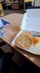 Child feeds sparrows at Saint Petersburg McDonald's
