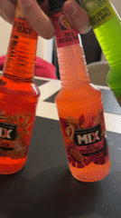 Person displays MIX cocktail bottles in Plovdiv, Bulgaria