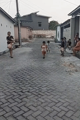 Neighborhood street gathering with kids' games in Indonesia