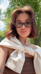 Woman photographs herself at landmarks in Sarapul, Russia