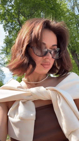 Woman photographs herself at landmarks in Sarapul, Russia
