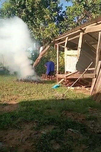 Rural Kenyan family conducts daily household chores and meal preparation