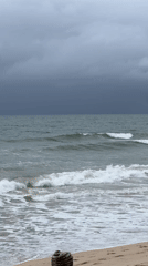Stormy beach conditions documented by witnesses during early morning hours