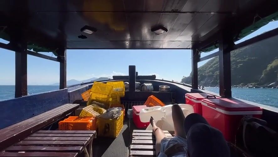 Fisher rests aboard working boat near Nha Trang coast