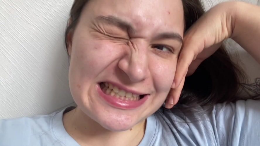 Woman makes playful faces during morning selfie session
