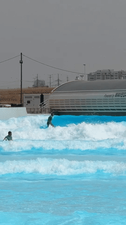 Surfer rides artificial waves at Tel-Aviv wave pool