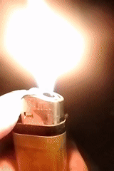 Person lights mosquito coil with lighter in Dhaka evening