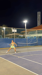Evening tennis match observed on outdoor Tel-Aviv court