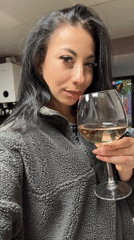 Woman enjoys white wine in Warrington evening