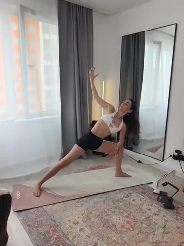 Solo yoga and fitness session self-filmed in Tyumen apartment