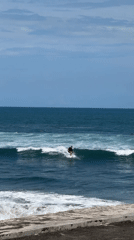 Early morning surfing session captured off Kediri coast