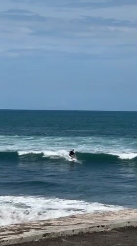 Early morning surfing session captured off Kediri coast