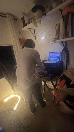 Late-night DJ session documented in cluttered Mexico City room