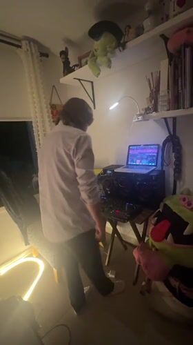 Late-night DJ session documented in cluttered Mexico City room