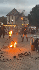 Fire performers dazzle a crowd in Belokurikha at dusk