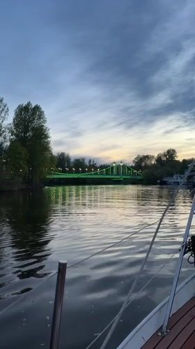 Evening documentation captures bridge and park scenes in Rusanovo