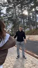 Couple shares playful moments at Da Lat scenic viewpoint
