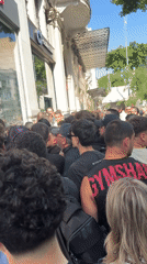Crowd gathers outside closed Swatch store in Thessaloniki