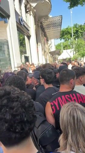 Crowd gathers outside closed Swatch store in Thessaloniki