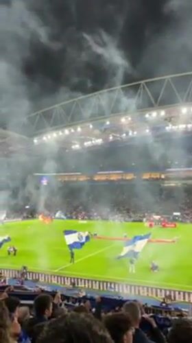 Porto stadium hosts nighttime soccer match with blue lighting spectacle