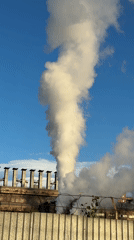Industrial smokestack venting over Magnitogorsk's steel-city skyline