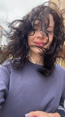 Woman enjoys windy morning outdoors in Krasnodar