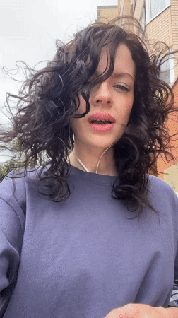 Woman enjoys windy morning outdoors in Krasnodar