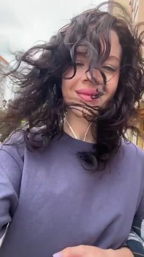 Woman enjoys windy morning outdoors in Krasnodar