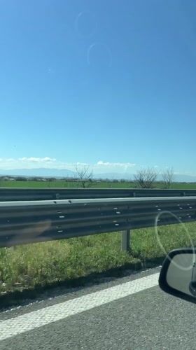 Highway travel documented near Orizovo, Bulgaria on sunny morning
